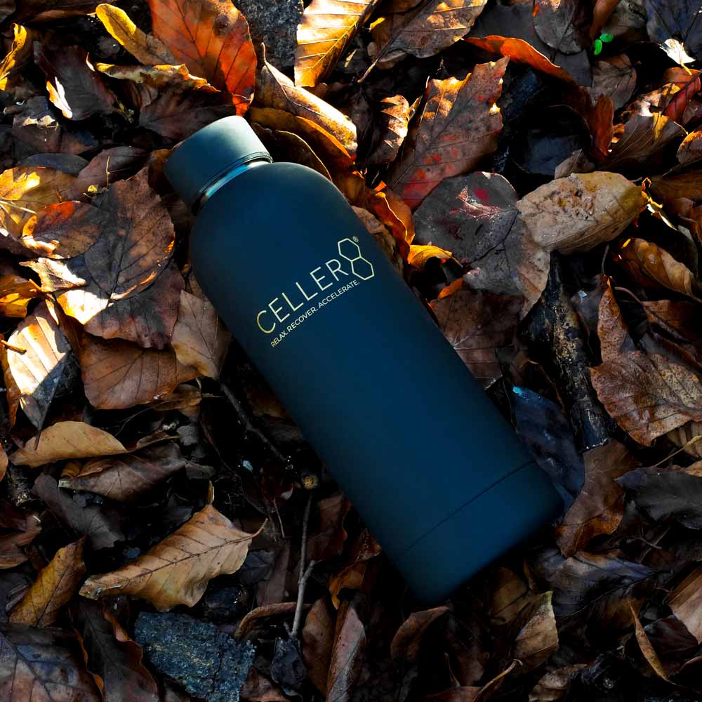 Black CELLER8 bottle in leaves