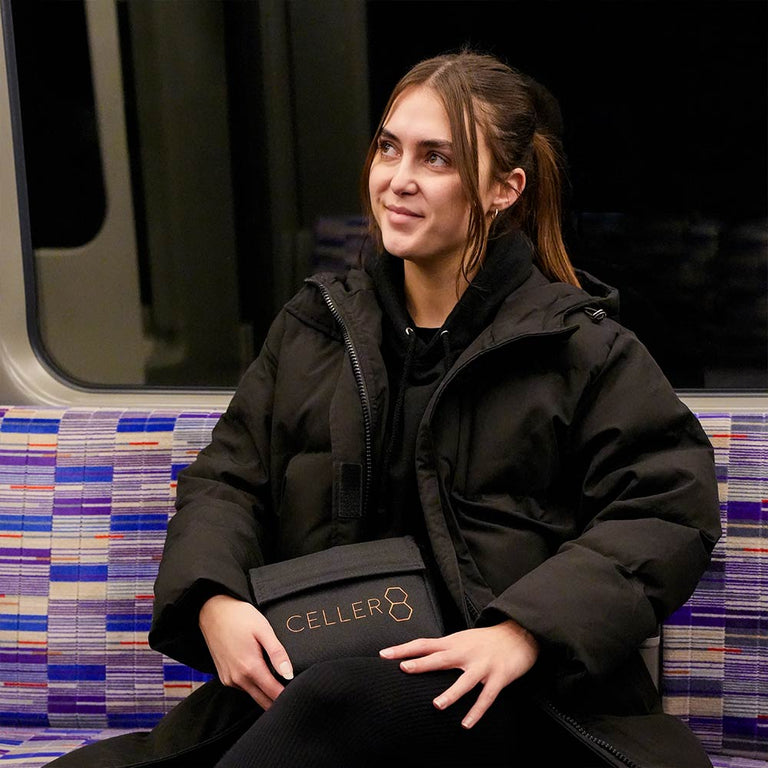 holding CELLER8 carry bag on train