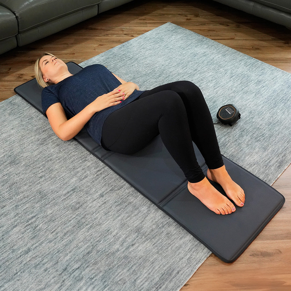CELLER8 full body mat laid out on floor with lady laying on top 
