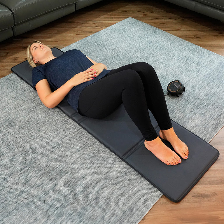 CELLER8 full body mat laid out on floor with lady laying on top 