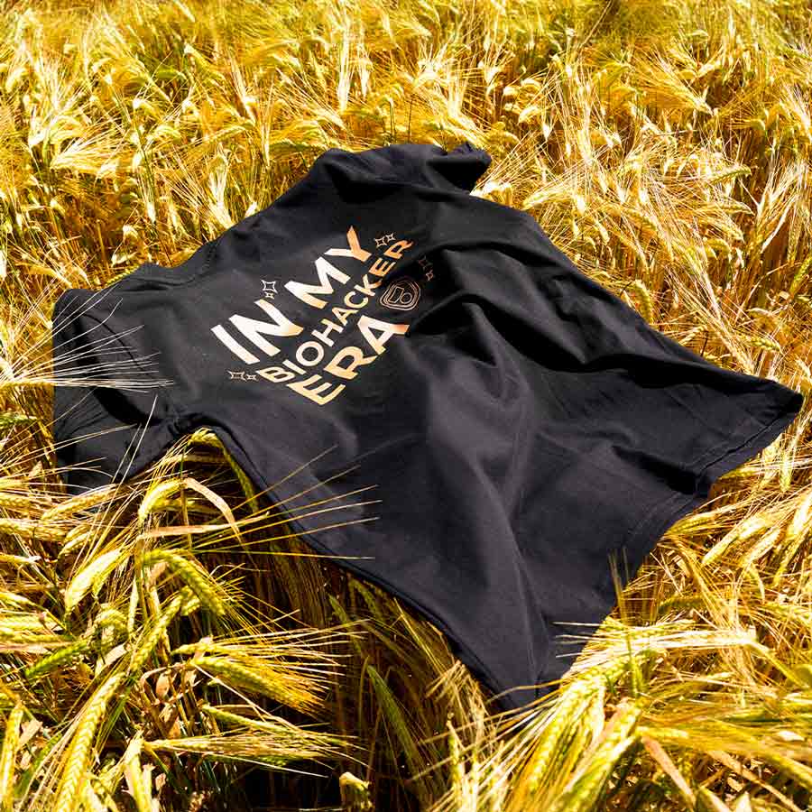CELLER8 Biohacker Era t-shirt laid out across wheat crops