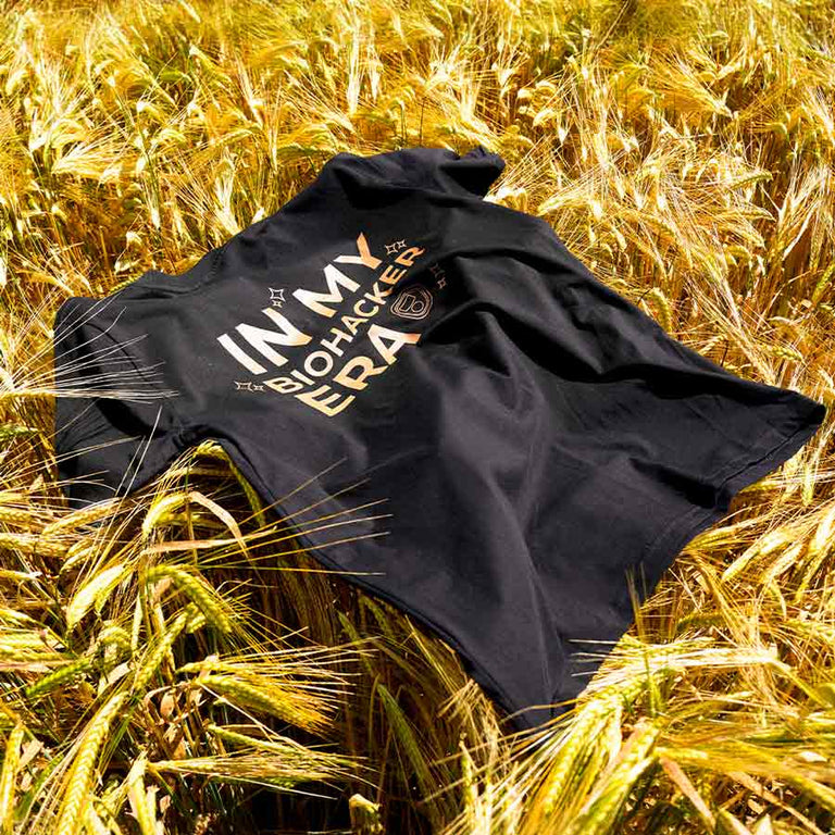 CELLER8 Biohacker Era t-shirt laid out across wheat crops