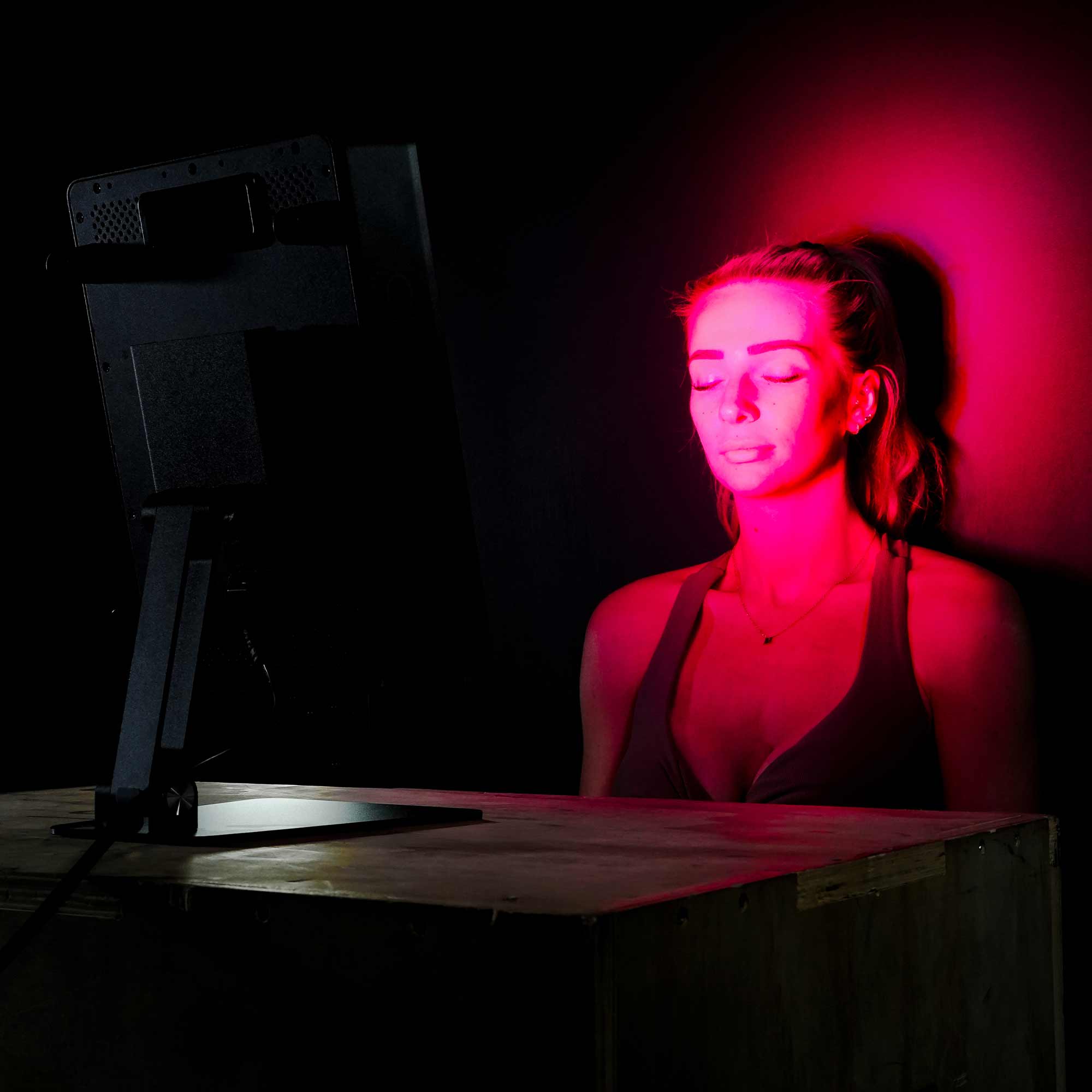 Sitting in front of desktop red light