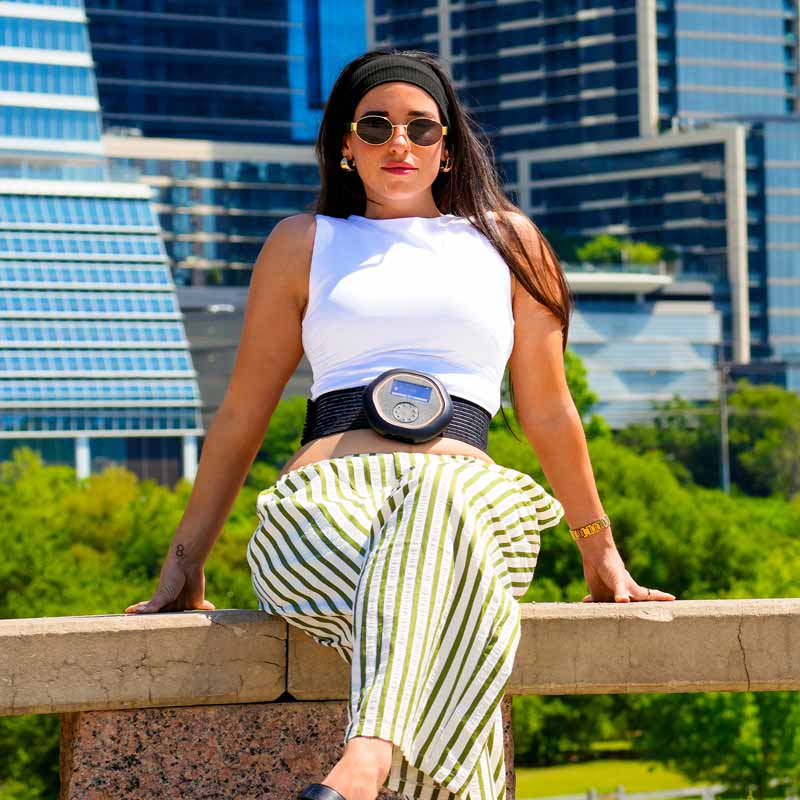 Women with CELLER8 around waist with Austin Texas skyline in background