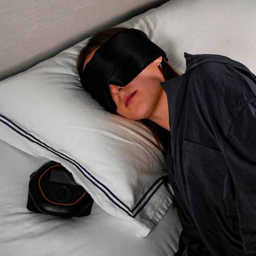 Women with CELLER8 under pillow to help aid sleep