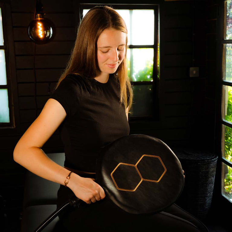 Woman holding CELLER8 max large loop over stomach 