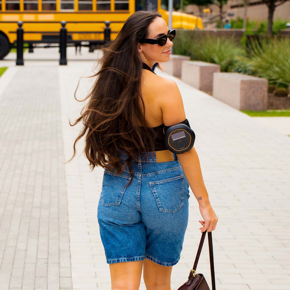 Women walking down street wearing CELLER8 on elbow