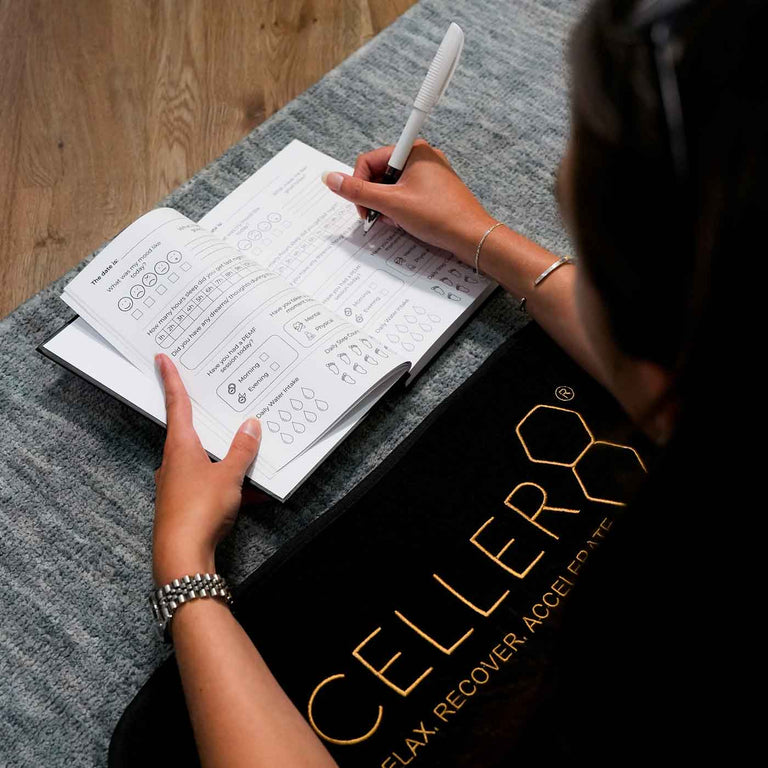 Writing in CELLER8 journal while on full body mat