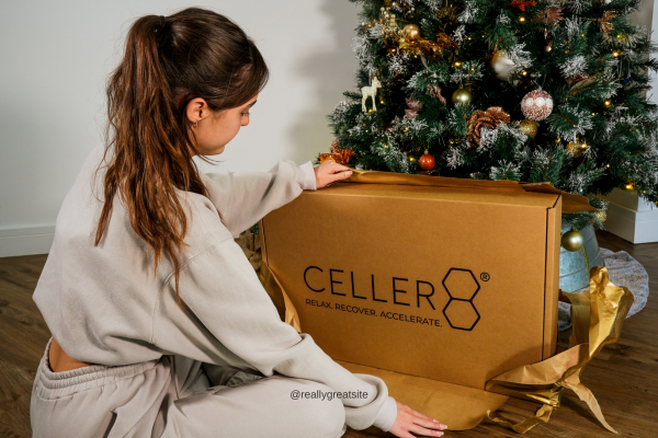 Woman wearing the CELLER8 PEMF device on her lower back.