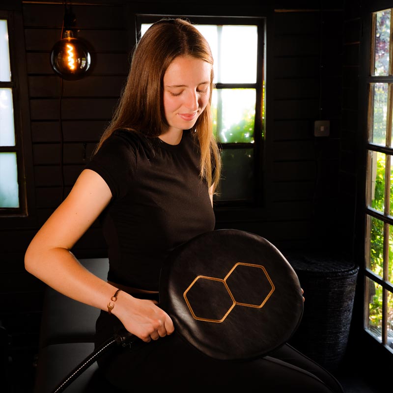 Women applying CELLER8 large loop to stomach