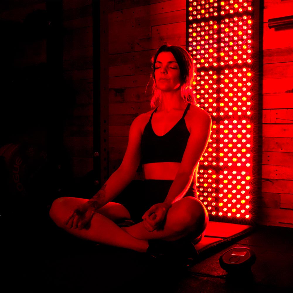 Lady sat in front of red light panel on CELLER8