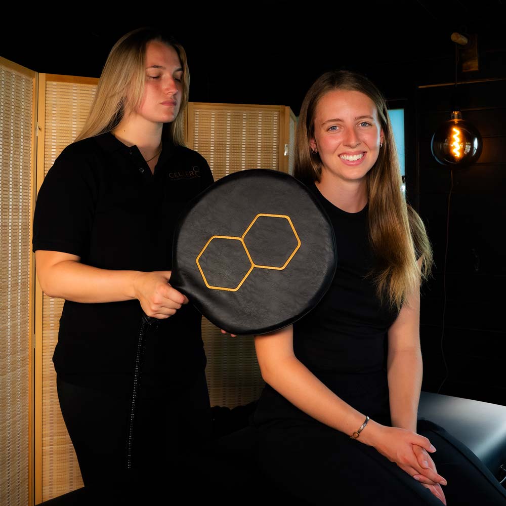 Women holding large loop coil on arm